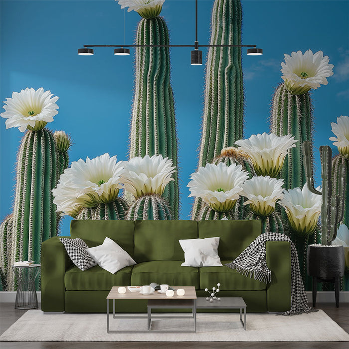 Foto Behang bloeiende cactus | Majestueuze cactus met witte bloemen op een blauwe achtergrond