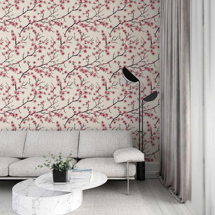 Fototapet körsbärsblomma | Mönster av grenar prydda med rosa blommor på en beige bakgrund
