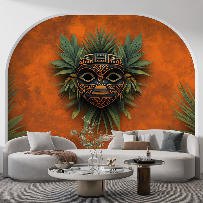 Tapeta plemenska maska | Črna in oranžna maska obdana s tropskim listjem