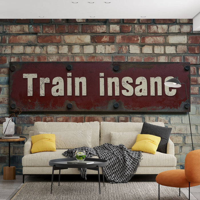 Fototapet motivation fitness | Slogan 'Träna galen' på en tegelbakgrund